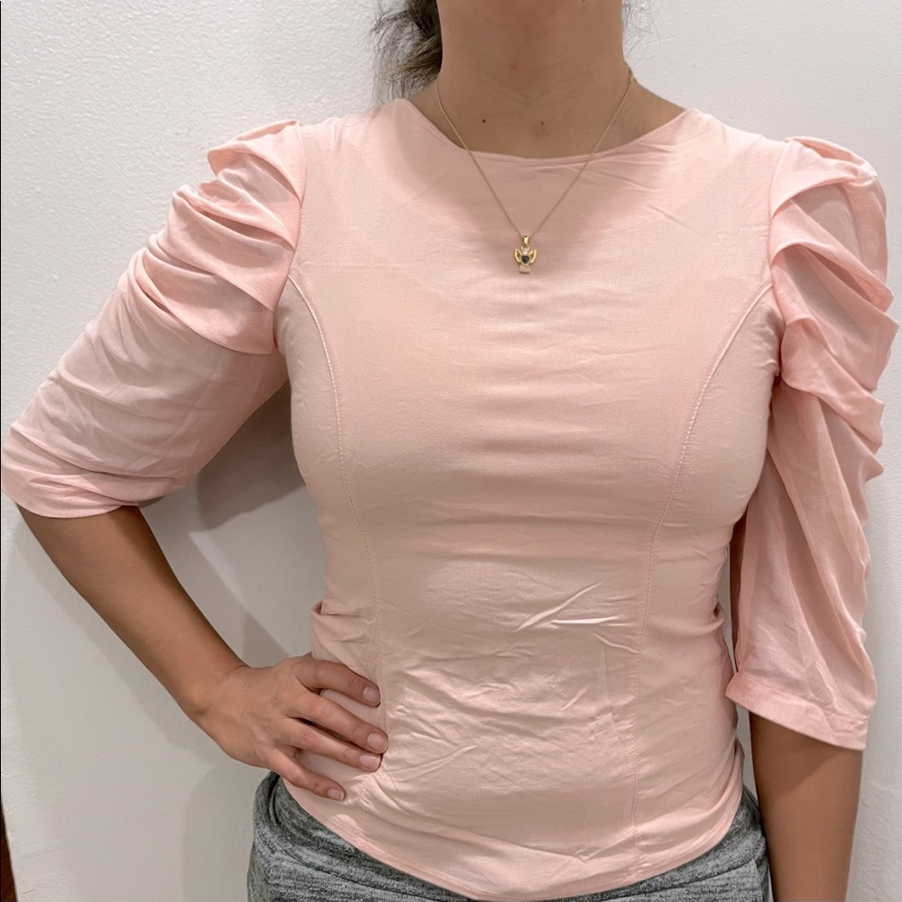 Beautiful light pink blouse with detail in shoulder